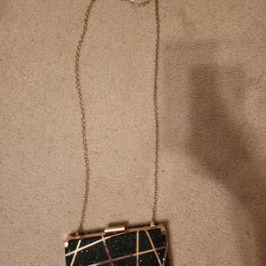 Elegant Black and Gold Women's Clutch